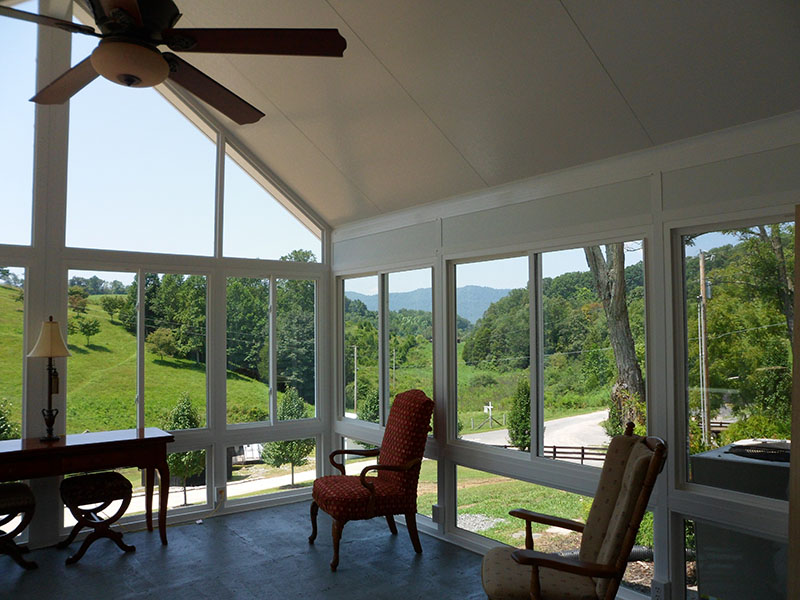 Sunroom addition with deck access by ATC Sunrooms